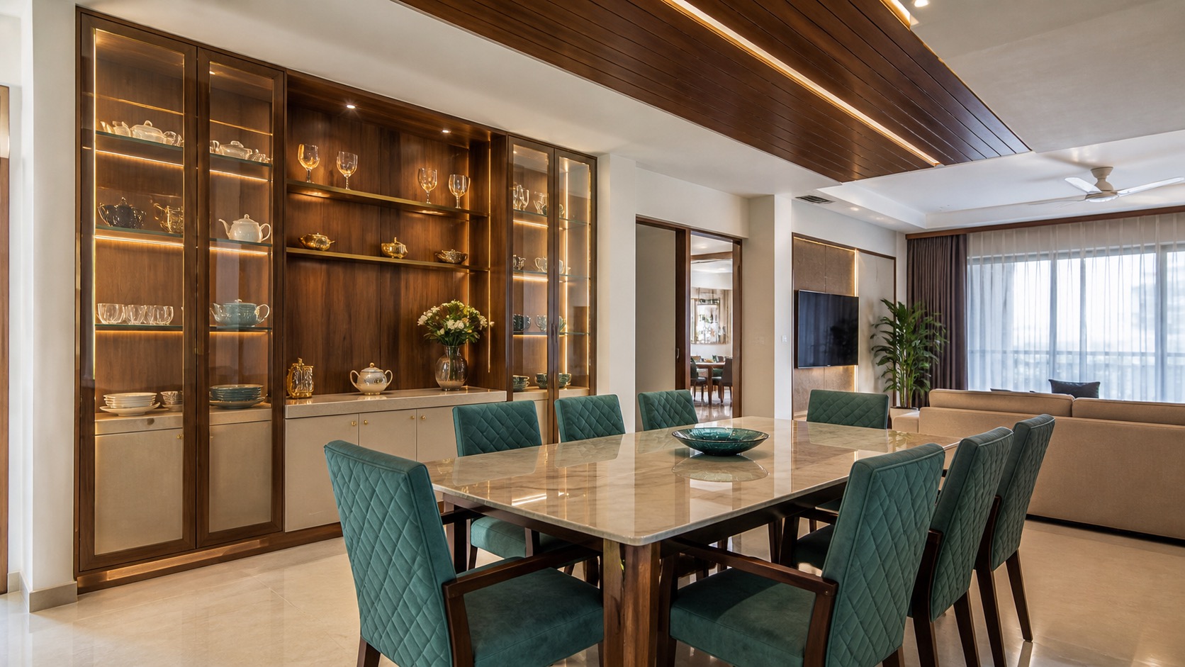 Dining room with crockery display, teal chairs and matching wood ceiling detail - Lakshi Home Interior Chennai